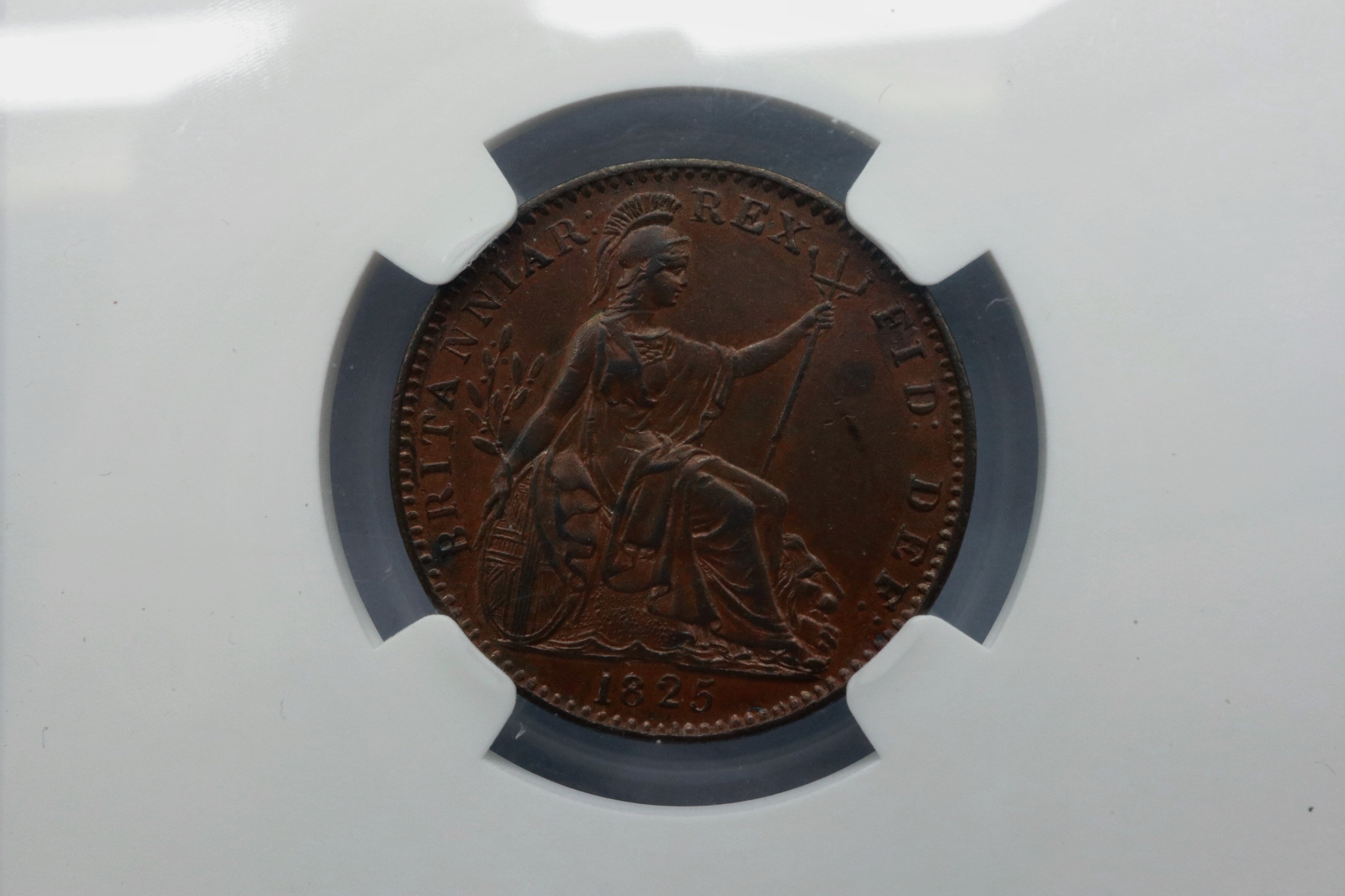 Slabbed and graded 1825 farthing (NGC MS62BN). P&P Group 1 (£14+VAT for the first lot and £1+VAT for