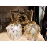 Seiko Quartz brass and glass mantle clock and Two floral polychrome glass lamp shades. H:19cm. Not