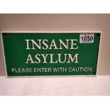 Cast iron Insane Asylum sign, W: 30 cm. P&P Group 1 (£14+VAT for the first lot and £1+VAT for