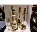 Pair of brass candlestick lamps, a brass column lamp and a marble and brass lamp, (4). All