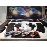 Aurora Jaguar challenge set with four lane Le Mans circuit and four cars with lights, appears in