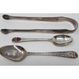 Pair of hallmarked silver sugar tongs and two hallmarked silver teaspoons, combined 52g. UK P&P