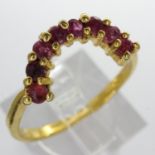 10ct gold ring set with eight rubies, size O/P, 1.6g. UK P&P Group 0 (£6+VAT for the first lot