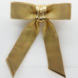 Christian Dior gold plated bow form brooch, H: 60 mm, 19g. UK P&P Group 0 (£6+VAT for the first