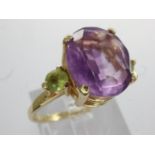 14ct gold trilogy ring set with amethyst and emerald, size M/N, 2.7g. UK P&P Group 0 (£6+VAT for the