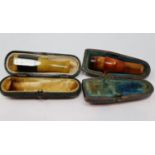 Two amber cheroot holders, cased. UK P&P Group 1 (£16+VAT for the first lot and £2+VAT for