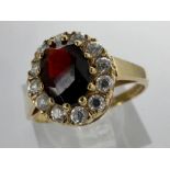 9ct gold cluster ring set with garnet and cubic zirconia, size L, 1.2g. UK P&P Group 0 (£6+VAT for