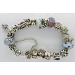 925 silver Pandora charm bracelet with twenty charms, boxed, L: 20 cm. UK P&P Group 1 (£16+VAT for