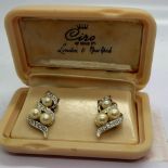 White metal clip on earrings set with pearl and cubic zirconia, in a bakelite case by Ciro of Bond