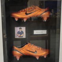 Signed and framed Ronaldo boots with photo of signing, with CoA. Not available for in-house P&P
