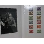 An album of Third Reich related ephemera including publicity shot photographs, safe conduct pass