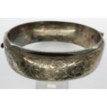 Hallmarked silver snap bangle, safety chain damaged, D: 70 mm, 28.2g. UK P&P Group 1 (£16+VAT for