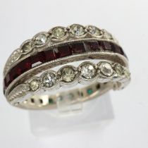 Antique white metal day/night ring set with garnet, emerald and cubic zirconia, missing two
