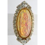 Yellow metal brooch set with large opal and cubic zirconia, L: 40 mm. UK P&P Group 1 (£16+VAT for
