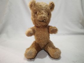 Vintage straw filled teddy bear, jointed arms and legs, H: 30 cm. UK P&P Group 1 (£16+VAT for the