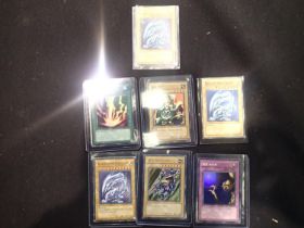 Small collection of sought after Yu-Gi-Oh! trading cards, to include three Blue-Eyes White Dragon.