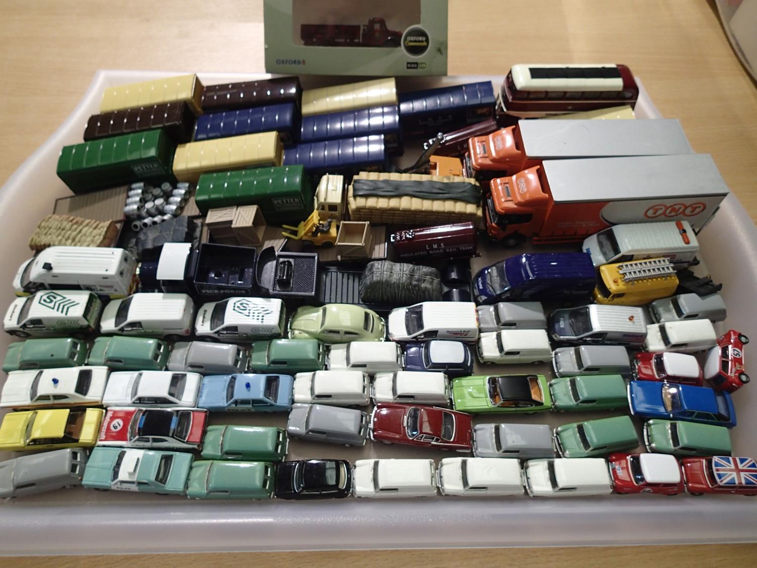 Approximately 70 OO scale cars/trucks/ trailers etc, various makes, mostly in excellent condition.