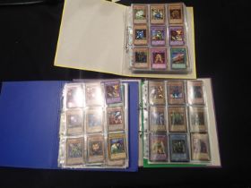 Three folders of Yu-Gi-Oh! trading cards, around 200 + cards. UK P&P Group 1 (£16+VAT for the
