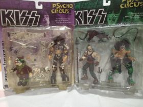 Two Kiss action figure sets by McFarlane toys; Paul Stanley The Jester, Peter Criss The Animal