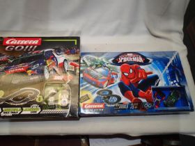 Two Carrera 1/43 scale slot car sets, Marvel Ultimate Spiderman and Rally Up, both appear complete