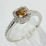 White gold diamond ring set with princess cut yellow diamond and diamond shoulders, size K, 2.2g. UK