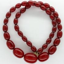Cherry amber beaded necklace, L: 46 cm, largest bead L: 20 mm. UK P&P Group 1 (£16+VAT for the first