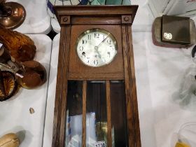 Oak cased Westminster chiming wall clock, with service history. Not available for in-house P&P