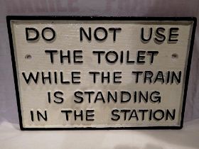 Cast iron 'Do not use the toilet' sign, W: 27 cm. UK P&P Group 1 (£16+VAT for the first lot and £2+