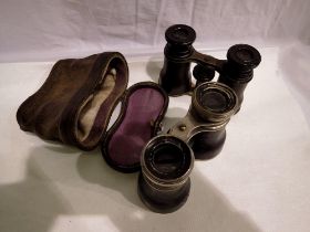 Vintage binoculars, marked 'Chevalier Optical Paris' in leather case and another pair unmarked. UK