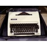 Adler Junior 12 mechanical typewriter in hard case. Not available for in-house P&P