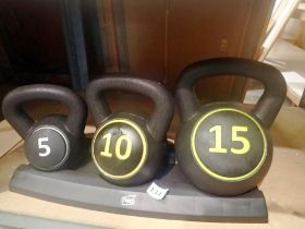 New old stock Maverick fitness kettle bells on stand 5, 10 and 15kg. Not available for in-house P&P.