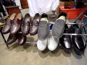 Extending chrome shoe rack with six pairs of shoes, EU 44 = UK 10, EU 45 = UK 10.5. Not av