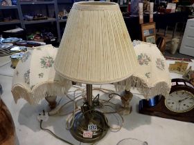 Three table lamps including a pair with alabaster bases. All electrical items in this lot have