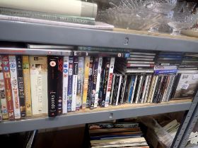 Large quantity of CDs and DVDs including CSI Miami boxset. Not available for in-house P&P