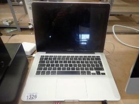 Apple Macbook Pro with charger (unknown model, number has faded), no login details when powere