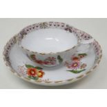 Hand painted floral teacup and bowl saucer, chip to rim of teacup and slight wear to gilt. UK P&P