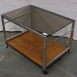 A mid 20th century chrome framed table in the Merrow Associates manner with smoked glass top and