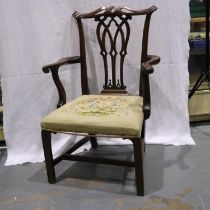 A 19h century mahogany framed gentlemans elbow chair in the Chippendale manner, with Berlin style