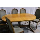 Nathan: A suite of dining furniture, comprising an oval extending dining table and a set of six (4+