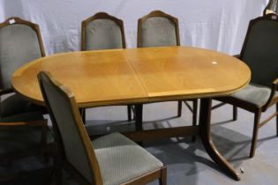 Nathan: A suite of dining furniture, comprising an oval extending dining table and a set of six (4+