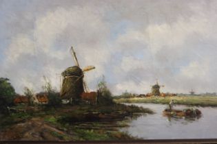 W Van Ourt (Dutch, 19th century): oil on canvas canal scene with windmills, 84 x 54 cm. Not