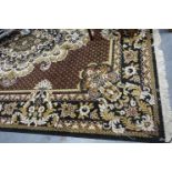 A 20th century floor rug, fringed and with floral designs against a black ground. Not available