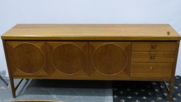 Nathan: A 1960s teak asymmetric sideboard in the Circles Design, one drawer knob detached but