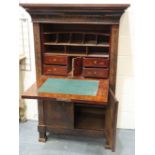 An early 19th century continental walnut scriptoire, with drop front and fitted interior,
