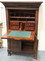 An early 19th century continental walnut scriptoire, with drop front and fitted interior,