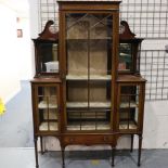 An Edwardian inlaid walnut display cabinet, with mirrored upstand and single drawer. Not available