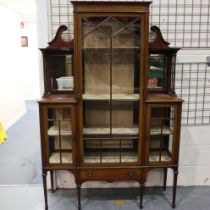 An Edwardian inlaid walnut display cabinet, with mirrored upstand and single drawer. Not available