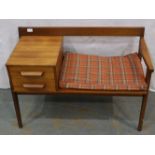 A mid 20th century teak telephone table with two drawers. Not available for in-house P&P