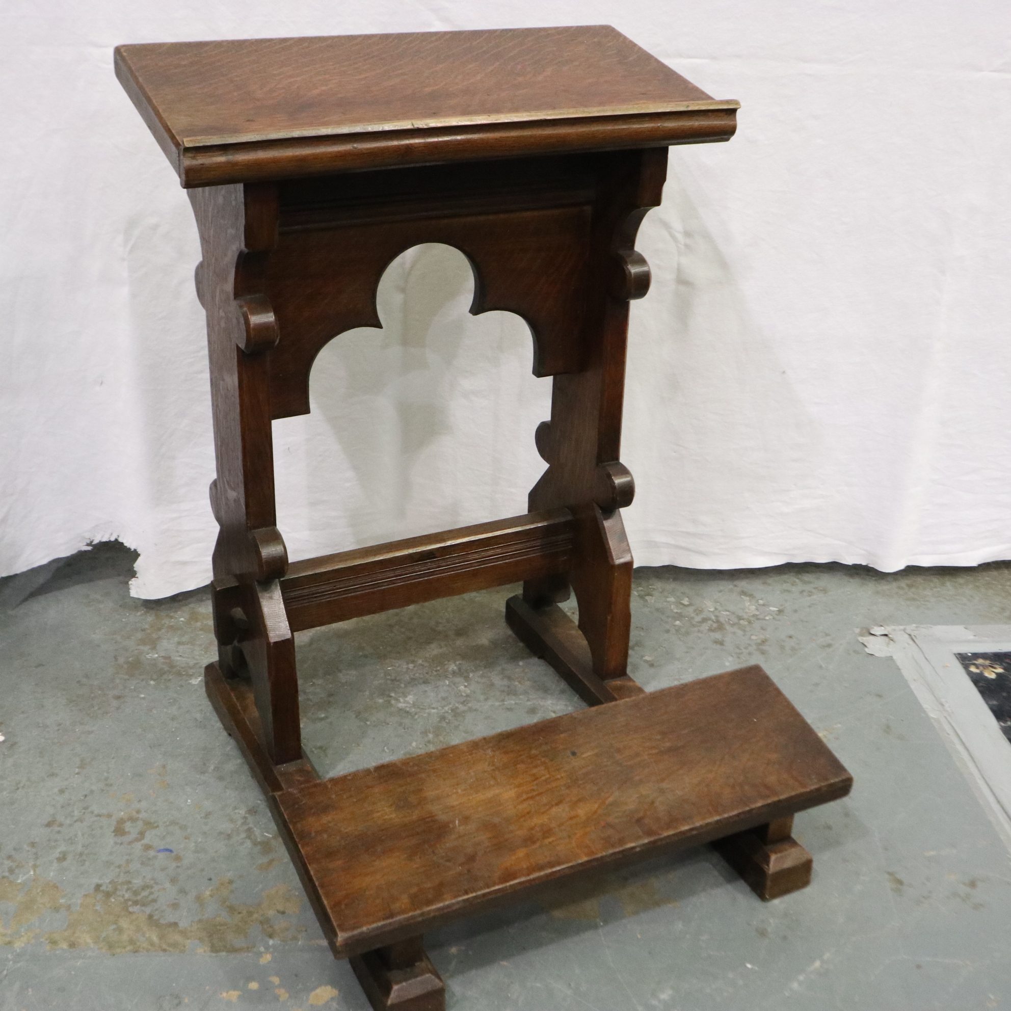A 19th century oak ecclesiastical kneeler with book rest, 60 x 60 x 84 cm H. Not available for in-