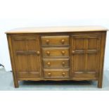 Ercol old colonial sideboard of drawers and cupboards, 145 x 52 x 90 cm H. Not available for in-